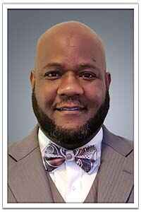 A man with a beard and bow tie.