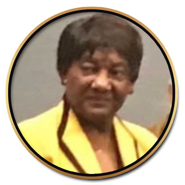 A picture of an older woman in yellow.