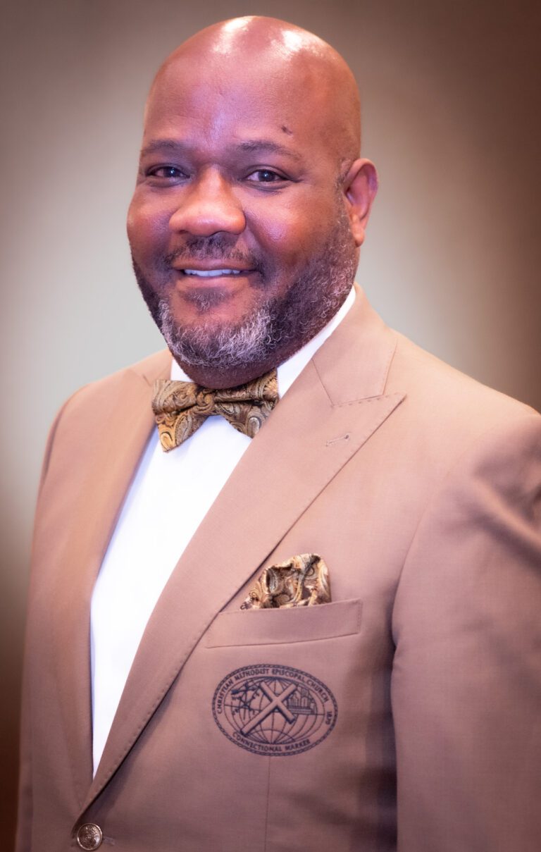 Portrait of a man in a brown suit.